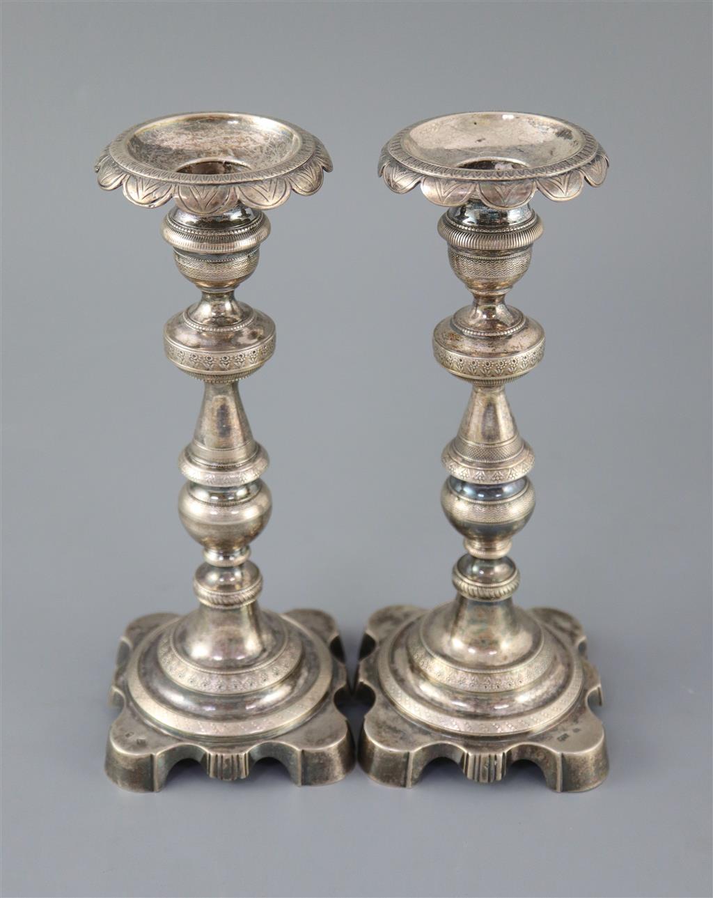 Two 19th century Brazilian? cast silver candlesticks,